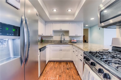 Updated kitchen with granite counters, new cabinets and stainless steel appliances