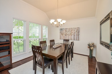 Lots of Natural Light and a Beautiful Chandelier in the Dining Room