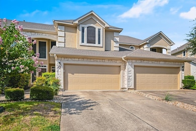 View of front of property featuring driveway, sto