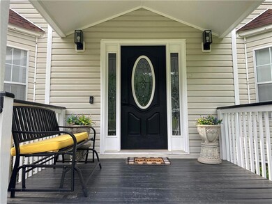 Entrance to property featuring a porch