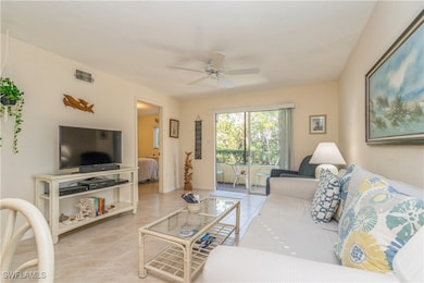 Great room with sliders to screened lanai