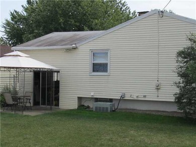 Exterior Back. Fenced in Yard.  Sliding glass door