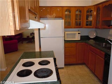 Kitchen - Kitchen features glass front cabinetry