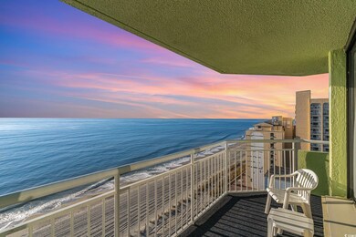 Balcony at dusk featuring an oceanfront view from 