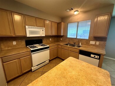 Kitchen with gas stove and island.