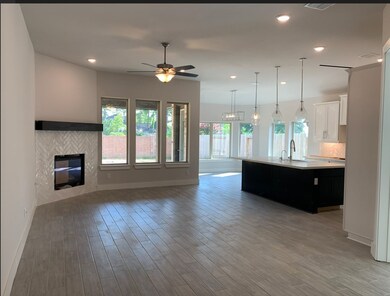Gorgeous family room with gas fireplace and oversized breakfast area for family gatherings