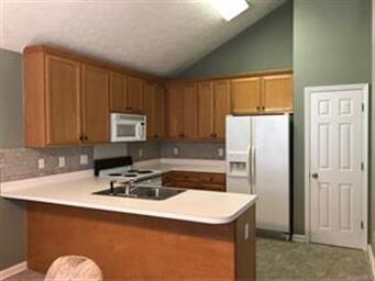 The kitchen with pantry.  The refrigerator remains