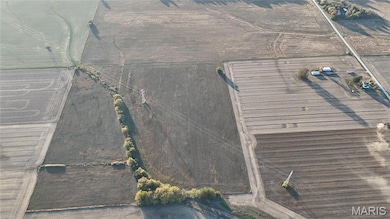 Aerial view of property and surrounding area featuring rural landscape