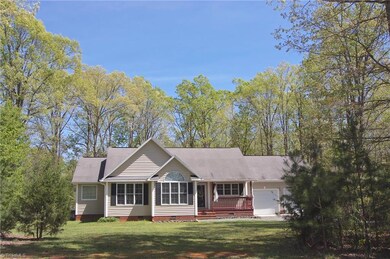 Tucked in a picturesque setting, who can resist this well-priced ranch?!