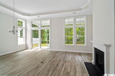 Unfurnished living room with wood finished floors,