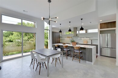 Dining space featuring concrete floors, visible v