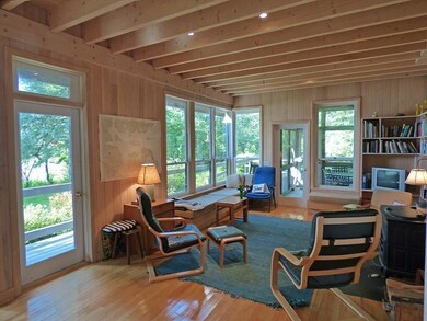 Living room with access to deck and...