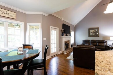 Dining area with ornamental molding, dark wood fin