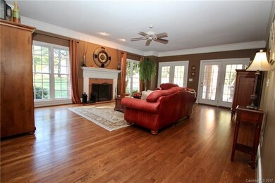 Large great room with wood burning fireplace, open