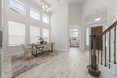 Entryway featuring light wood-style floors, a hea