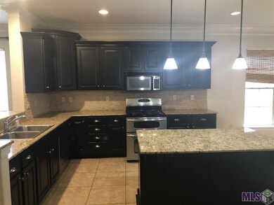 GRANITE COUNTER TOPS AND STAINLESS STEEL APPLIANCE