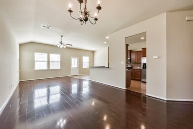 Spacious family room seamlessly connects to the ki