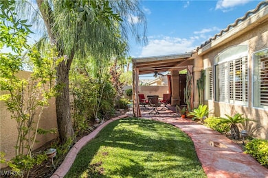 Fenced backyard with a patio