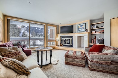 Living area featuring a tile fireplace