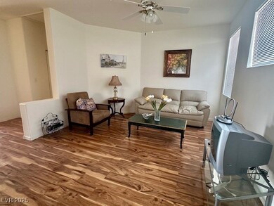 Living area featuring wood finished floors and a c