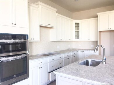Kitchen is open to the gathering room. Stainless s