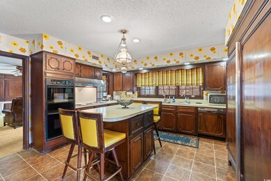 Kitchen featuring hanging light fixtures, a kitche
