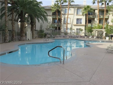 Pool featuring a patio area and fence