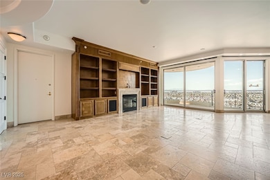 Unfurnished living room featuring stone tile floor