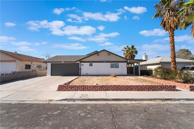 Ranch-style house featuring driveway and a garage