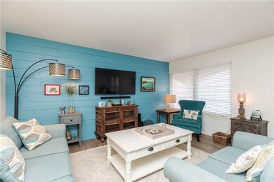 Furnished Living Room with Shiplap Accent Wall