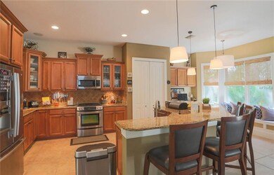 Kitchen with huge breakfast bar open to living roo