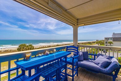 Deck with a water view, a view of the beach, and outdoor dining space