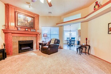 NEW carpet and a classy fireplace in the living ro
