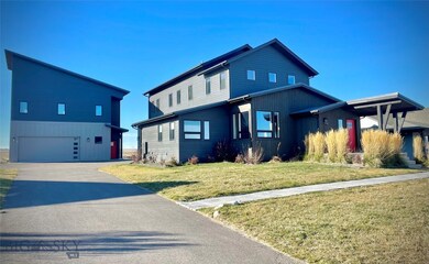 View of front facade featuring a guest house and f
