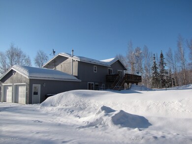 Rear of home, yard and extra parking