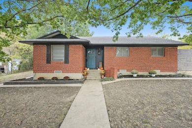 Ranch-style house featuring crawl space, brick siding, and roof with shingles