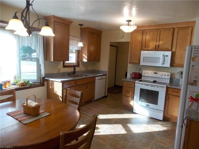 Totally updated kitchen featuring quality cabinetry and granite counters. Plenty of space for dining. All kitchen appliances included.