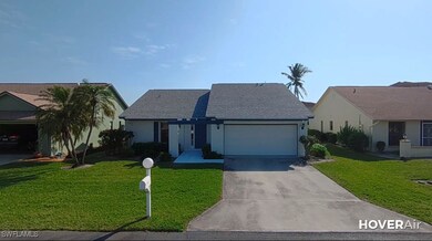 View of front facade with a garage and a front yar