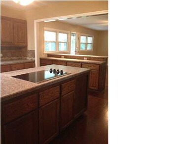View from island cook top into family room. Everyt