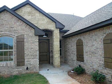 Exterior Front. Brick & Stone.  Neighborhood Pool.