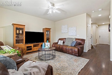 Living room with recessed lighting, baseboards, ce