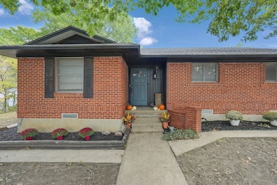 Ranch-style home featuring brick siding