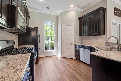 4 burner gas stove beautiful dark cabinets.