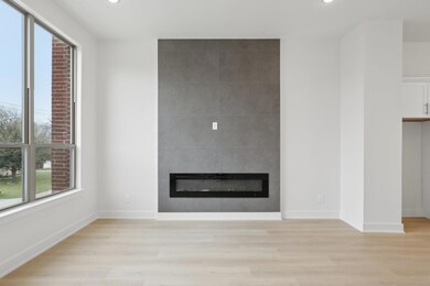 Unfurnished living room featuring a large fireplac