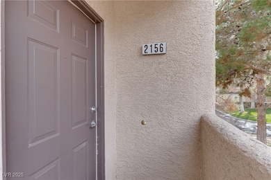Doorway to property with stucco siding