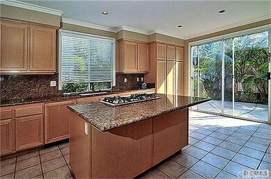 GOURMET CENTER ISLAND GRANITE KITCHEN WITH BREAKFA