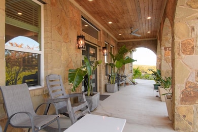 View of patio with ceiling fan