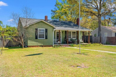 View of front facade with fence, a chimney, crawl 
