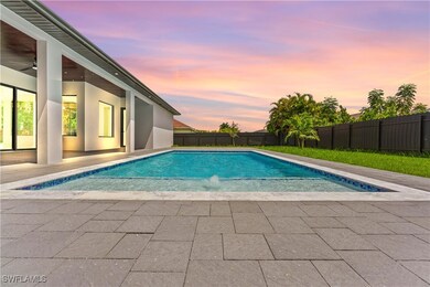 Pool at dusk with a patio area