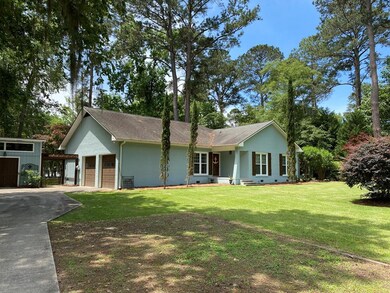 Concrete drive leads to garage